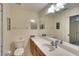 Bathroom with single sink vanity, toilet and large mirror at 811 Fairwaycove Ln # 107, Bradenton, FL 34212