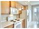 Clean and efficient kitchen with white appliances at 811 Fairwaycove Ln # 107, Bradenton, FL 34212