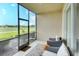 Relaxing screened porch with outdoor seating and golf course view at 811 Fairwaycove Ln # 107, Bradenton, FL 34212