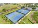 Community tennis courts with surrounding landscape at 811 Fairwaycove Ln # 107, Bradenton, FL 34212