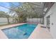 Screened-in pool with patio furniture at 1807 Robinhood St, Sarasota, FL 34231