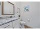 Small bathroom with single vanity and toilet at 1807 Robinhood St, Sarasota, FL 34231