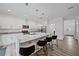 Modern kitchen featuring white cabinets, expansive island, and stainless steel appliances at 1807 Robinhood St, Sarasota, FL 34231