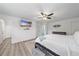 Main bedroom with king-size bed and mounted TV at 1807 Robinhood St, Sarasota, FL 34231