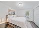 Spacious bedroom with a king-size bed, large windows, and double doors at 1807 Robinhood St, Sarasota, FL 34231