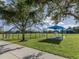 Community park with shaded seating, sports field, and playground at 11406 Belvedere Ter, Lakewood Ranch, FL 34211