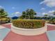 Landscaped garden with circular planter and statue at 11406 Belvedere Ter, Lakewood Ranch, FL 34211