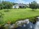 Aerial view of house showcasing a large backyard and pond at 11406 Belvedere Ter, Lakewood Ranch, FL 34211