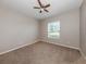 Well-lit bedroom featuring neutral walls and plush carpeting at 11406 Belvedere Ter, Lakewood Ranch, FL 34211