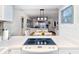 Modern kitchen with a breakfast bar overlooking dining and living areas at 1801 Gulf N Dr # 275, Bradenton Beach, FL 34217