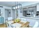 Bright dining area with a farmhouse table and modern lighting at 1801 Gulf N Dr # 275, Bradenton Beach, FL 34217