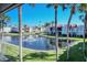 Scenic view of the community's pond with a fountain and palm trees at 1801 Gulf N Dr # 275, Bradenton Beach, FL 34217