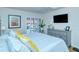 Spacious bedroom with king bed, dresser, and large TV at 1801 Gulf N Dr # 275, Bradenton Beach, FL 34217