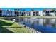 Condo community with pond, fountain, and lush landscaping at 1801 Gulf N Dr # 275, Bradenton Beach, FL 34217