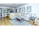 Relaxing living area with gray sectional and wood-look floors at 1801 Gulf N Dr # 275, Bradenton Beach, FL 34217