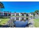 Condo community with pond, fountain, and lush landscaping at 1801 Gulf N Dr # 275, Bradenton Beach, FL 34217