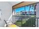Private balcony overlooking a tranquil canal and lush landscaping at 1801 Gulf N Dr # 275, Bradenton Beach, FL 34217