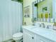 Clean bathroom with white vanity, shower/tub combo, and decorative artwork at 1801 Gulf N Dr # 275, Bradenton Beach, FL 34217