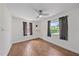 Bright bedroom with wood-look tile floors and large windows at 1321 Groveland Ave, Venice, FL 34285