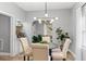 Cozy dining room adjacent to the living area with stylish lighting and furnishings at 807 E Genesee St, Tampa, FL 33603