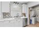 Modern kitchen features white cabinets, stainless steel appliances, and stylish backsplash at 807 E Genesee St, Tampa, FL 33603