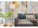 A stylish living room features a comfortable gray sectional sofa, complete with decorative pillows and unique wall art at 807 E Genesee St, Tampa, FL 33603