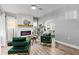 Bright living room features a modern fireplace, stylish furniture, and hardwood floors at 807 E Genesee St, Tampa, FL 33603