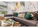 A stylish living room features a comfortable gray sectional sofa, complete with decorative pillows and unique wall art at 807 E Genesee St, Tampa, FL 33603