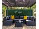 Inviting outdoor space with stylish sectional seating, vibrant cushions, and lush green backdrop at 807 E Genesee St, Tampa, FL 33603