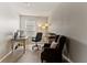 Bright home office features a large desk, comfortable chair, and ample natural light at 404 158Th E St, Bradenton, FL 34212