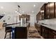 Kitchen with stainless steel appliances, granite countertops and an island at 404 158Th E St, Bradenton, FL 34212