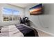 Bedroom with a bed, large TV, and home office area at 404 158Th E St, Bradenton, FL 34212