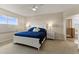 Spacious main bedroom with a large bed, nightstands, and ensuite bathroom access at 404 158Th E St, Bradenton, FL 34212