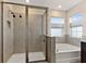 Modern bathroom with a large shower, bathtub, and updated fixtures at 404 158Th E St, Bradenton, FL 34212
