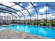 Relaxing screened pool and lanai overlooking a lake with neighborhood views at 404 158Th E St, Bradenton, FL 34212