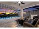 Relaxing pool area with covered patio, fire pit, and seating at 404 158Th E St, Bradenton, FL 34212