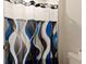 Clean bathroom with shower and patterned curtain at 404 158Th E St, Bradenton, FL 34212