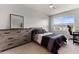 Bright bedroom with a double bed, dresser, and workspace at 404 158Th E St, Bradenton, FL 34212