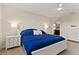 Bright and airy main bedroom with a white bed frame and ensuite bathroom access at 404 158Th E St, Bradenton, FL 34212