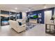 Living room with white couches, a large TV, and a pool view at 404 158Th E St, Bradenton, FL 34212