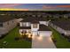 Two-story house in a residential neighborhood with a lake at 404 158Th E St, Bradenton, FL 34212