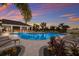 Inviting community pool with lounge chairs at 404 158Th E St, Bradenton, FL 34212