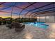 Screened pool and patio area with lounge chairs at 404 158Th E St, Bradenton, FL 34212
