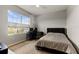 Comfortable bedroom with a bed, built-in desk area, and window view at 404 158Th E St, Bradenton, FL 34212