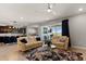 Open concept living room with sectional sofa and view into the kitchen at 404 158Th E St, Bradenton, FL 34212