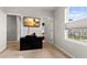 Spacious bedroom with large window, dresser, and access to other rooms at 404 158Th E St, Bradenton, FL 34212