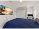 Bedroom with a queen-size bed, large TV and closet at 404 158Th E St, Bradenton, FL 34212