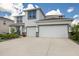 Two-story house with a two-car garage and a large driveway at 404 158Th E St, Bradenton, FL 34212