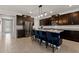 Open concept kitchen with stainless steel appliances and an island at 404 158Th E St, Bradenton, FL 34212