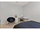 Bedroom with a queen bed, a corner desk, and a round chair at 404 158Th E St, Bradenton, FL 34212